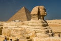 Great pyramid of Cheops and Sphinx in Giza plateau. Royalty Free Stock Photo