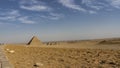 The great Pyramid of Menkaure and three small pyramids of queens stand on the Giza plateau Royalty Free Stock Photo