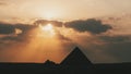 great pyramid of Mikerina in Cairo, Egypt. Pyramids of Menkaura against cloudy sky in the evening at a beautiful sunset Royalty Free Stock Photo