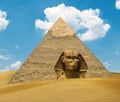 Great Pyramid of Pharaoh Khufu and the Sphinx on sand dunes - Egypt concept Royalty Free Stock Photo