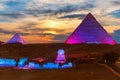 The Great Pyramids of Egypt and the Sphinx, enlighted at night, Giza Royalty Free Stock Photo