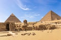 The Great Pyramids of Giza complex: the Sphinx, the Pyramid of Chephren, the temple and the Pyramid of Cheops, Egypt Royalty Free Stock Photo