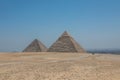 The Great Pyramids of Giza near the ruins of a temple in Giza, Egypt Royalty Free Stock Photo