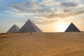 Great pyramids in Giza valley during sunset. World famous landmark in Egypt.