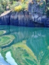 Great reflection of the rocky shore in the water of the river Sil in Galicia Spain. Royalty Free Stock Photo