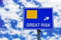 Great risk, blue road sign over dramatic cloudy sky Royalty Free Stock Photo