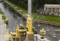 Great samson fountain with golden sculptures and tourist inside Peterhof Palace