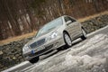 Cluj-Napoca,Romania - March 01,2018:Isolated Mercedes-Benz E class-alias W203,gold metallic colour,chrome ornaments blue tinted