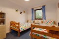 Childs bedroom with twin beds and star bedding