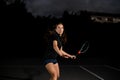 great shot of active female player with tennis racket on the outdoor tennis court.