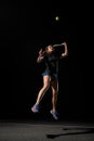 great shot of female tennis player with tennis racket in her hand bouncing to hit the tennis ball. Royalty Free Stock Photo