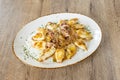 Great Spanish recipe for fried squid with their tips and caramelized onion