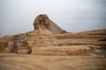 Great Sphinx against the background of the pyramids of the pharaohs Cheops  in Giza, Egypt Royalty Free Stock Photo