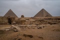 Great Sphinx against the background of the pyramids of the pharaohs Cheops and Khafre in Giza, Egypt Royalty Free Stock Photo