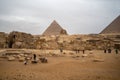 Great Sphinx against the background of the pyramids of the pharaohs Cheops and Khafre in Giza, Egypt Royalty Free Stock Photo