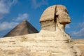 Great Sphinx on the background of pyramid in Egypt Royalty Free Stock Photo