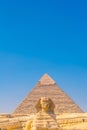 Great Sphinx of Giza and in the background the pyramid of Khafreand  Giza, Cairo, Egypt Royalty Free Stock Photo