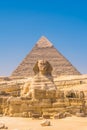 Great Sphinx of Giza and in the background the pyramid of Khafreand  Giza, Cairo, Egypt Royalty Free Stock Photo