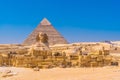 Great Sphinx of Giza and in the background the pyramid of Khafreand  Giza, Cairo, Egypt Royalty Free Stock Photo