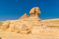 Great Sphinx of Giza and in the background the Pyramids of Giza, Cairo, Egypt Royalty Free Stock Photo