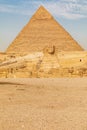 Great Sphinx of Giza in front of the Pyramid of Khafre in Giza Royalty Free Stock Photo