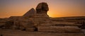 Great Sphinx of Giza Profile with Pyramid Silhouette at Sunset Royalty Free Stock Photo