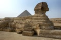 The Great Sphinx of Giza and the Pyramid of Khufu located on the Giza Plateau in Cairo, Egypt. Royalty Free Stock Photo