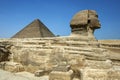 The Great Sphinx of Giza and the Pyramid of Khufu located on the Giza Plateau in Cairo, Egypt. Royalty Free Stock Photo