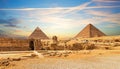 The Great Sphinx next to the Pyramids of Egypt at sunset, Giza desert Royalty Free Stock Photo