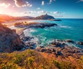 Great sunrise on popular tourist destination - Acropoli di Bithia with Torre di Chia tower on background.