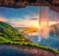 Great sunset on popular tourist destination - Seljalandsfoss waterfall,