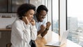 Young black husband wife read amazing news on laptop screen Royalty Free Stock Photo