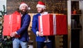 Great surprise. Prepare huge surprise gift. Men compete who has larger size. Bigger gift battle. Men santa carry big