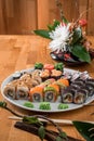 Great sushi set. Rolls with salmon, eel, avocado and tuna on a white plate. Royalty Free Stock Photo