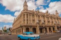 The Great Theater of Havana on a beautiful sunny day. Blue retro car single on the road Cuba