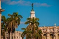 The Great Theater and palm trees closeup on blue sky background. Havana. Cuba