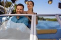 Cheerful couple enjoying themselves while sailing boat Royalty Free Stock Photo
