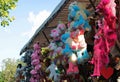 Great variety of cuddly toys hanging from the roof of a lottery
