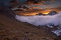 Great view of the foggy valley in Gran Paradiso National Park, Alps, Italy, dramatic scene, colourful autumn morning Royalty Free Stock Photo