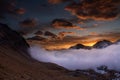 Great view of the foggy valley in Gran Paradiso National Park, Alps, Italy, dramatic scene, colourful autumn morning Royalty Free Stock Photo