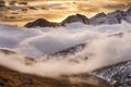 Great view of the foggy valley in Gran Paradiso National Park, Alps, Italy, dramatic scene, colourful autumn morning Royalty Free Stock Photo