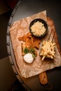 great view of french fries and bowl of sauerkraut and delicious batter fried pork ears on the table. Top view. Royalty Free Stock Photo