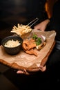 great view of french fries and bowl of sauerkraut and delicious batter fried pork ears Royalty Free Stock Photo