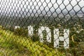 Great view of Los Angeles from the back of the Hollywood sign which is protected by a police fence, in the LA city of California