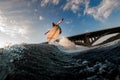 great view of male wakeboarder while jumping over splashing wave Royalty Free Stock Photo