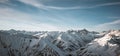 Great view of the massive snowy mountains. Amazing winter rocks above the cloud Royalty Free Stock Photo