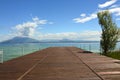 Great view of pier on Lake Garda from Sirmione beach, Italy