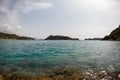 Great view of sky and turquoise sea surface and mountains at horizon Royalty Free Stock Photo