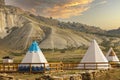 Great view of the tipi in the field with the American rocky mountain landscape in the background Royalty Free Stock Photo