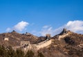 Great Wall of China: section with towers winding across a mountain ridge in winter under a blue sky Royalty Free Stock Photo